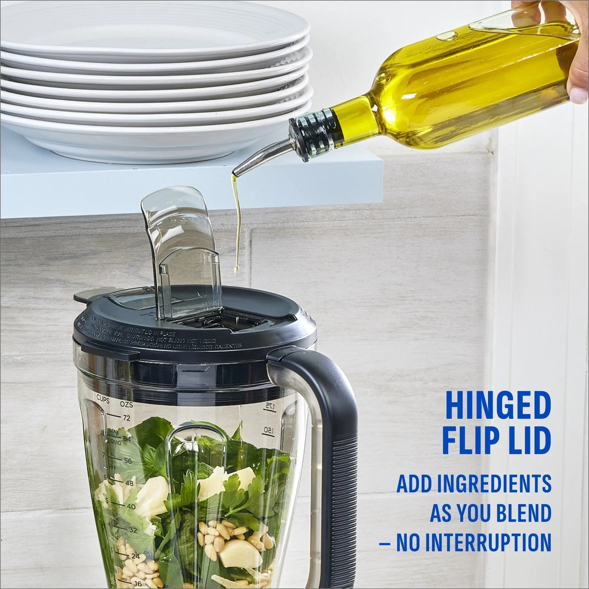 Olive oil being poured through the hinged flip lid