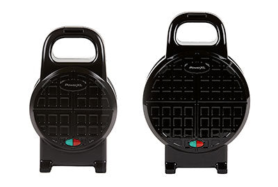Two black waffle makers on a white background