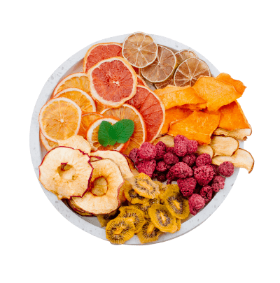 Assorted dried fruits on a white plate with a white background
