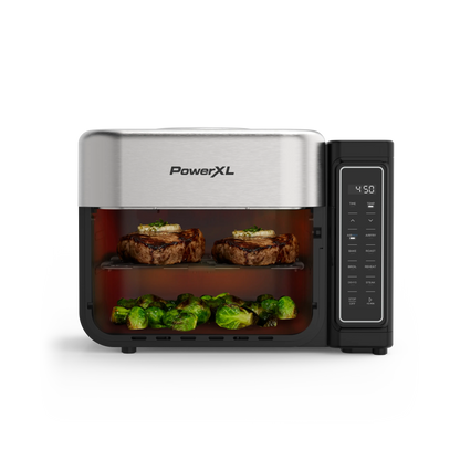 PowerXL toaster oven with food inside on a white background