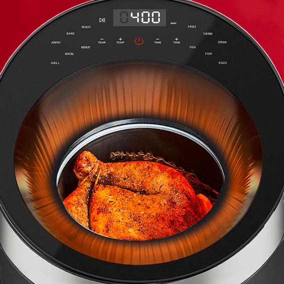 Roasted chicken inside a digital oven with visible temperature display.