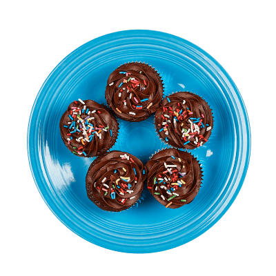 Chocolate cupcakes with sprinkles on a blue plate