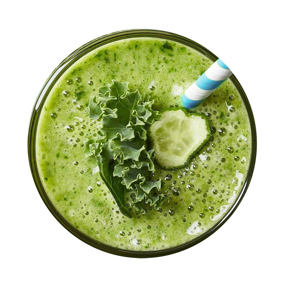Green smoothie with kale and cucumber in a glass on a white background